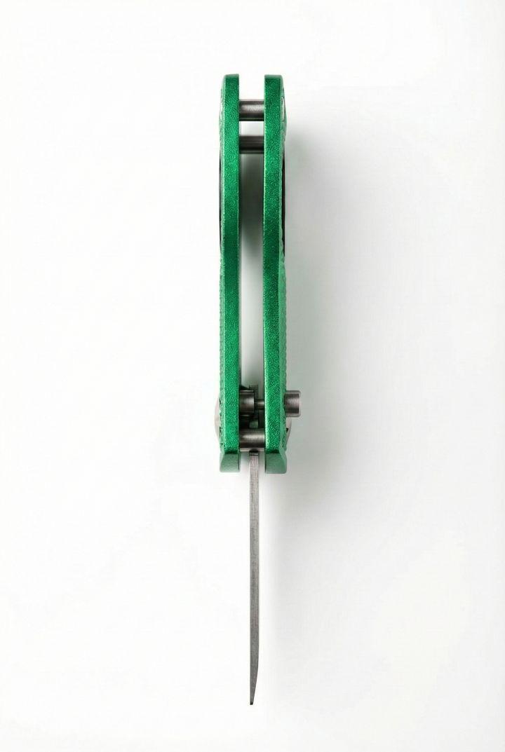 Limited edition divot tool in green with a metal spike, viewed from the top.