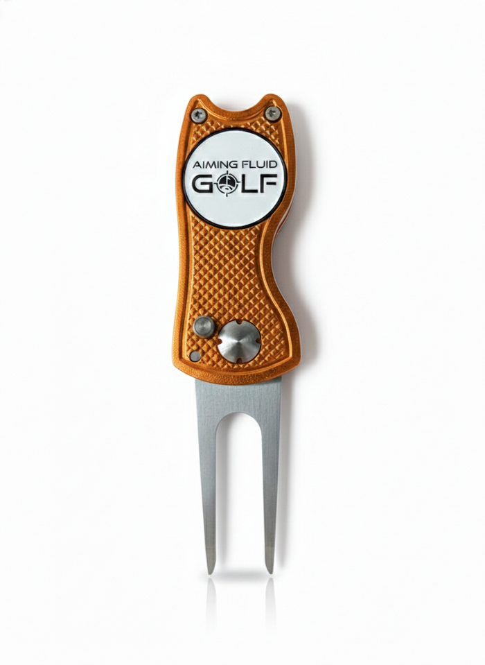 Limited edition divot tool with an orange textured handle and silver prongs, featuring a logo that reads "Aiming Fluid Golf.