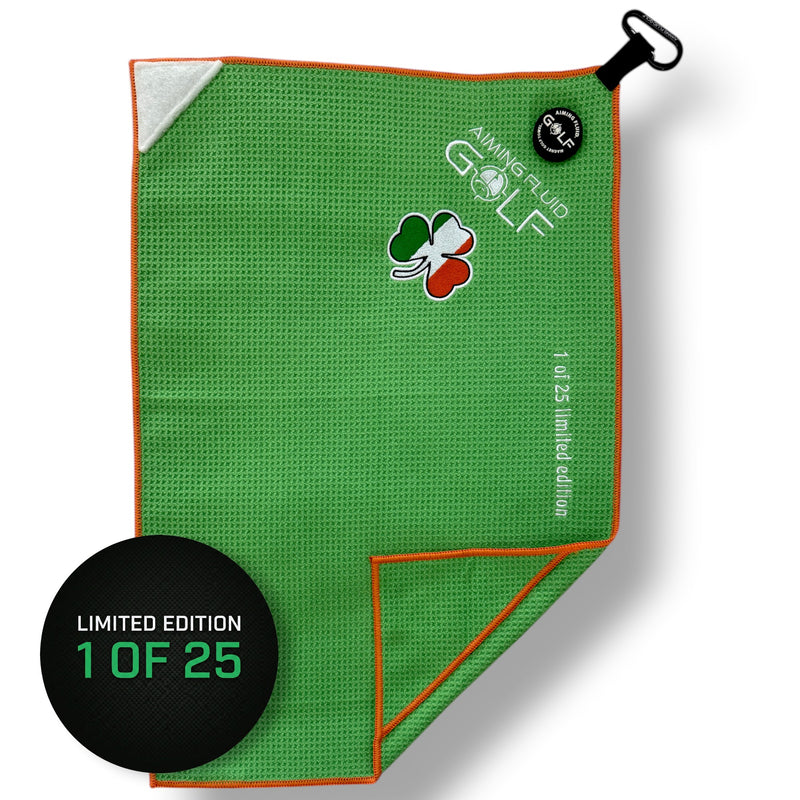 Green golf towel with a shamrock design and limited edition label on a white background aiming fluid golf limited edition golf towel 