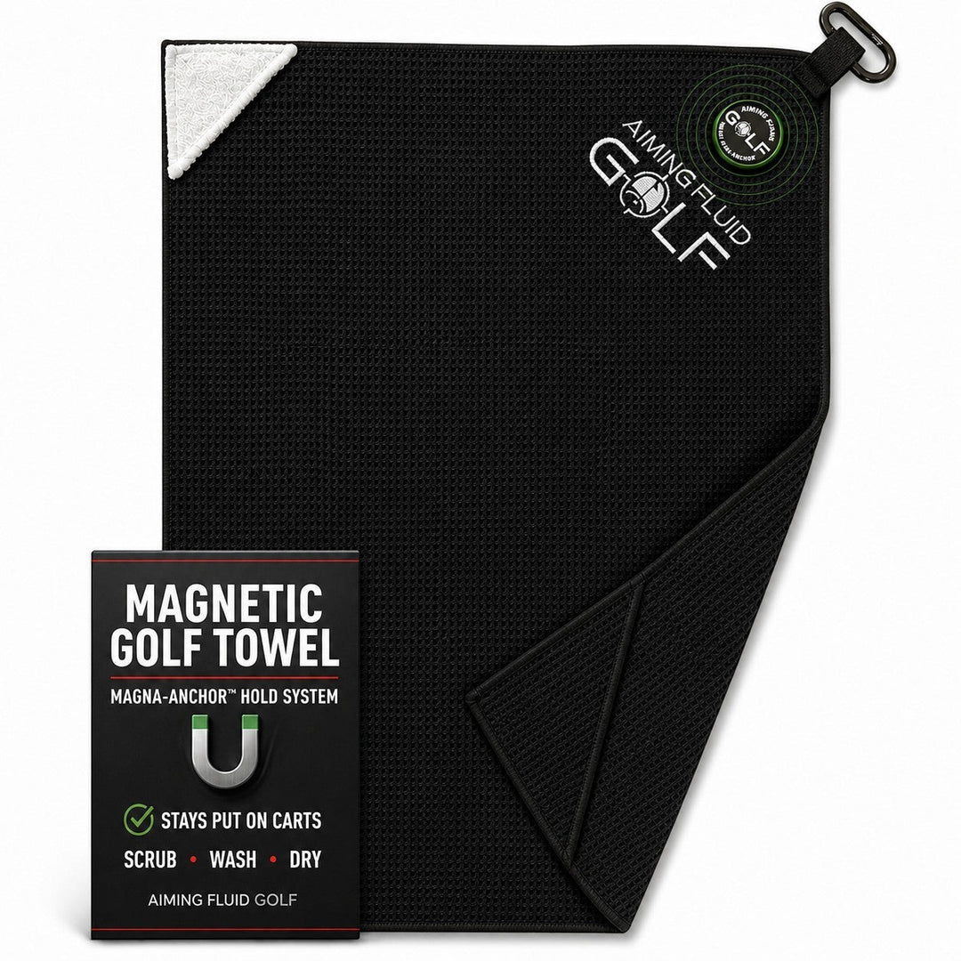 Aiming Fluid Golf black waffle-weave magnetic golf towel with a white corner accent and carabiner clip.