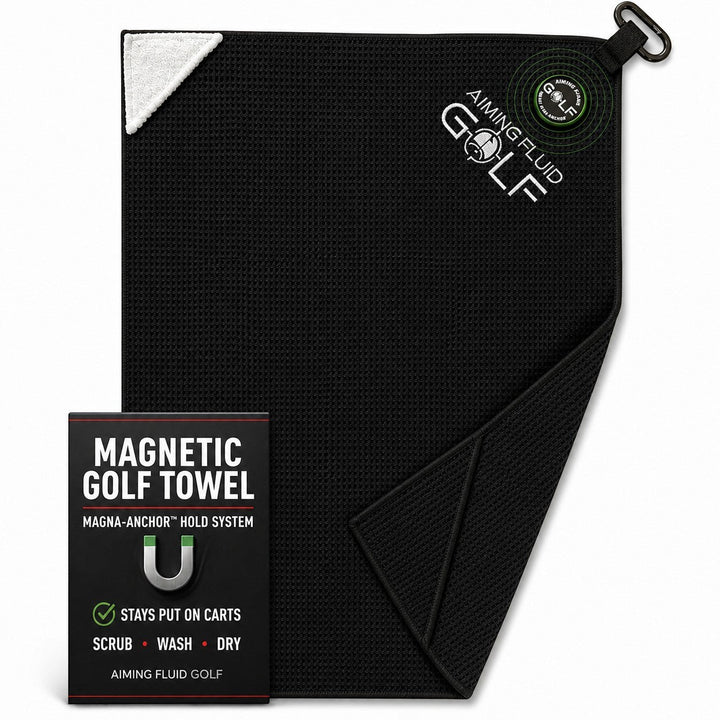 Aiming Fluid Golf black waffle-weave magnetic golf towel with a white corner accent and carabiner clip.