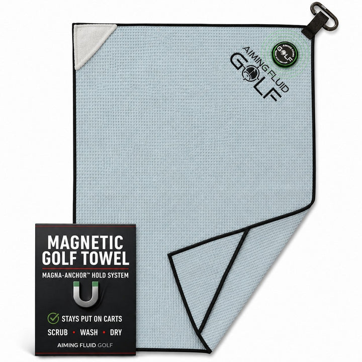 Aiming Fluid Golf light blue waffle weave magnetic golf towel with black trim and a carabiner clip.