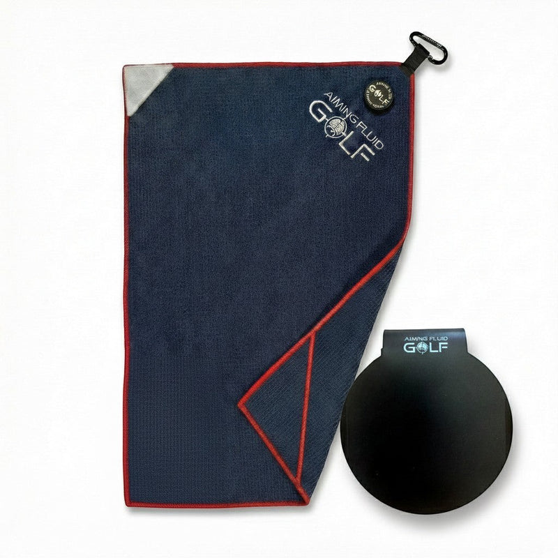 Aiming Fluid Golf navy blue microfiber golf towel with red trim and a black magnetic landing pad.