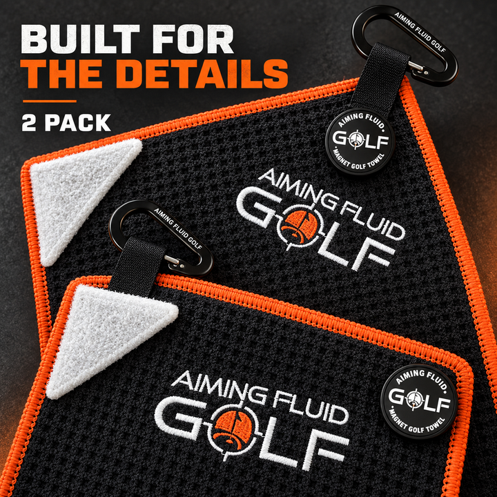 Close-up of two Hazard Orange towels showing waffle texture, scrub corners, magnets, and carabiners