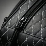 Close-up of the golf shoe bag showing fabric texture, stitching, and zipper detail.